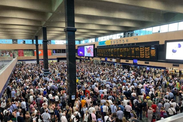 Crowds at Euston station in London, as commuters are enduring chaos and disruption on the railways as the UK swelters on its hottest July day on record