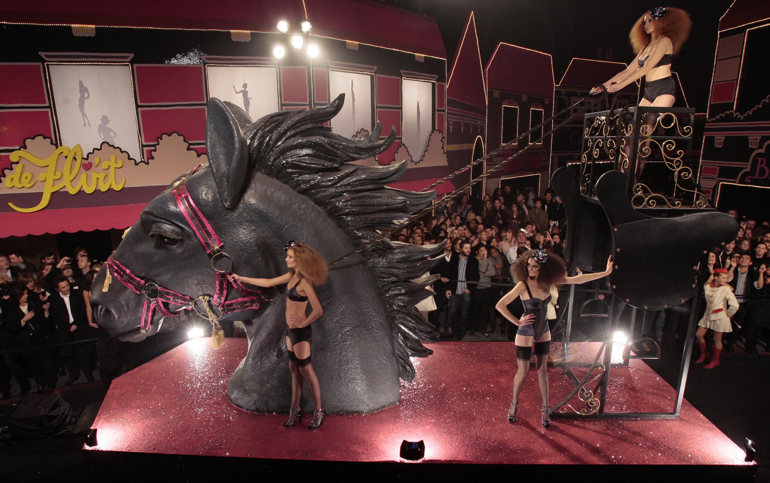 In 2009, the brand teamed up with H&M to launch a one-off lingerie collection. The range’s Moulin Rouge-inspired runway show, which took place at the Grand Palais in Paris, saw model Lily Cole enter the venue on float with a gigantic horse head. Eschewing a traditional catwalk, models showed off the designs on swings, toasting each other under a moving chandelier, and rolling around on a float of satin-covered beds.