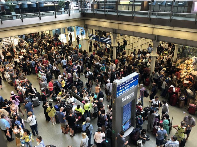 Crowd control: Police are in attendance as Eurostar passengers from cancelled trains try to rebook