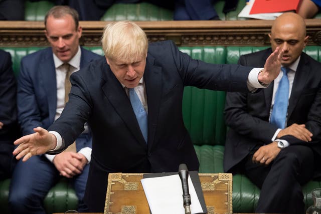 Boris Johnson gestures as he speaks in Parliament