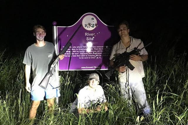 Three white boys suspended by fraternity after photo of them posing over memorial for brutally murdered 14-year-old Emmett Till is posted on Instagram