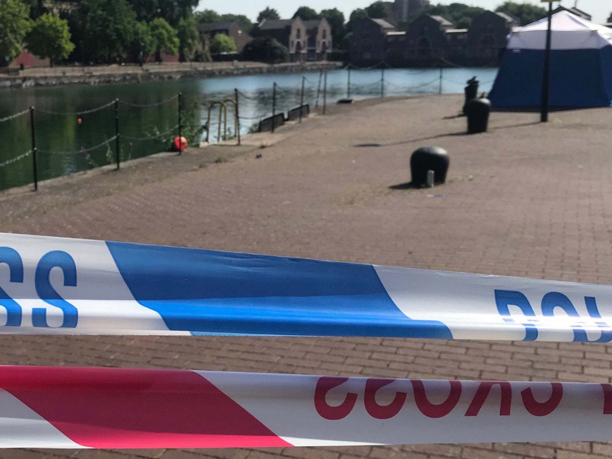 Police cordon at Shadwell Basin, where one of three missing swimmers was found on 24 July