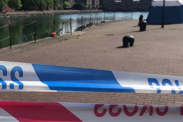 Police cordon at Shadwell Basin, where one of three missing swimmers was found on 24 July