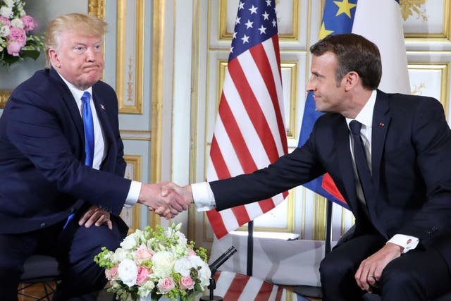 Donald Trump and Emmanuel Macron shake hands during a meeting in Caen, France, on 6 June 6, 2019, on the sidelines of D-Day commemorations marking the 75th anniversary of the World War II Allied landings in Normandy.
