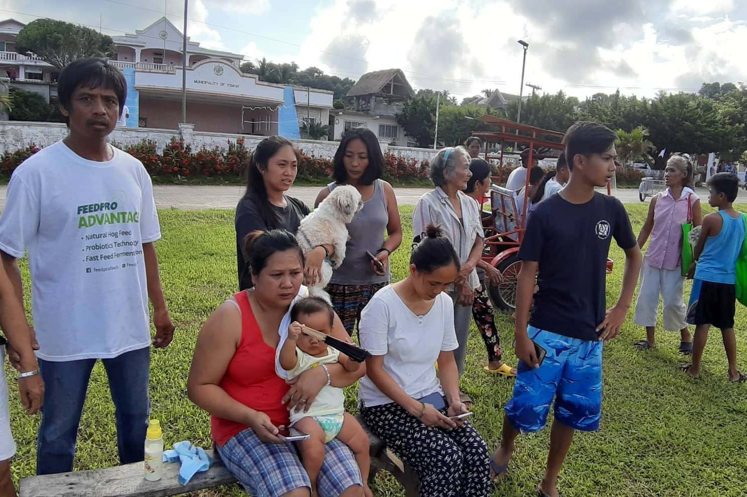 People gather on a field after an earthquake struck the Batanes Province, in northern Philippines