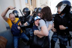 Riot police break up Moscow protest as thousands take to streets