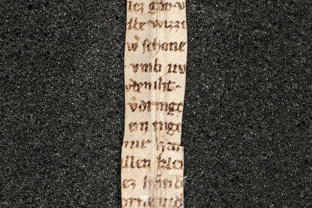 A strip of the poem ‘Der Rosendorn’ was found tied around a Latin text