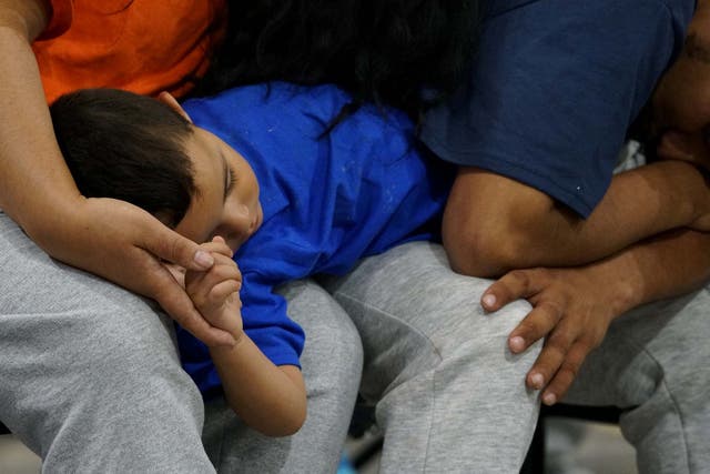 Asylum seekers wait at the Donna facility in Texas
