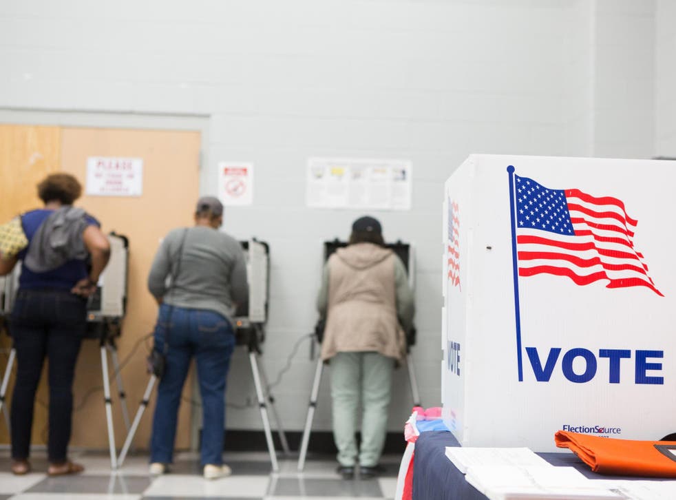 Voters cast ballots at CT Martin Natatorium and Recreation Center on 18 October 2018 in Atlanta, Georgia.