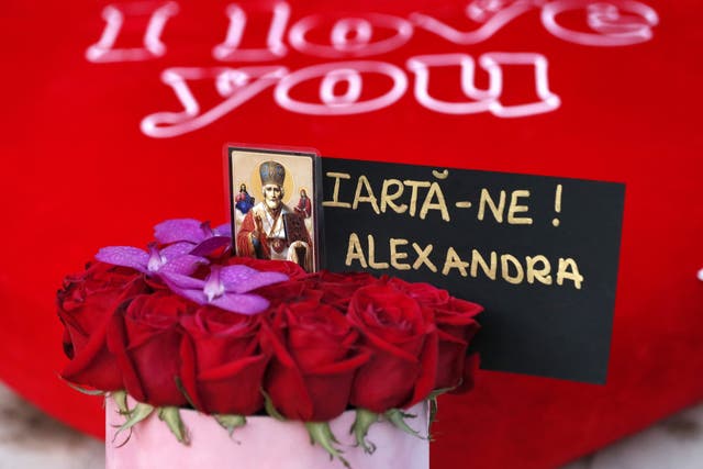 A bunch of red roses are seen at the makeshift shrine during a protest against the way Romanian authorities handled the kidnapping pf 15-year-old  Alexandra Macesanu