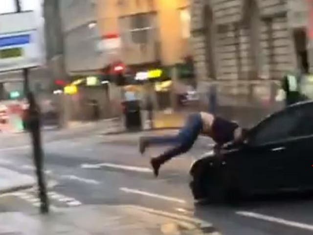 Still image taken from video shared on Facebook of a car appearing to drive at a man, knocking him to the ground in Newcastle city centre on 27 July 2019.