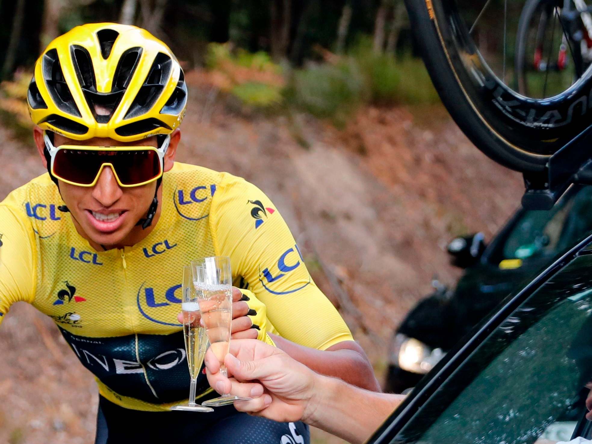 Egan Bernal gives a cheers to Dave Brailsford