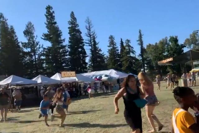 People run as an active shooter was reported at the Gilroy Garlic Festival, south of San Jose, California