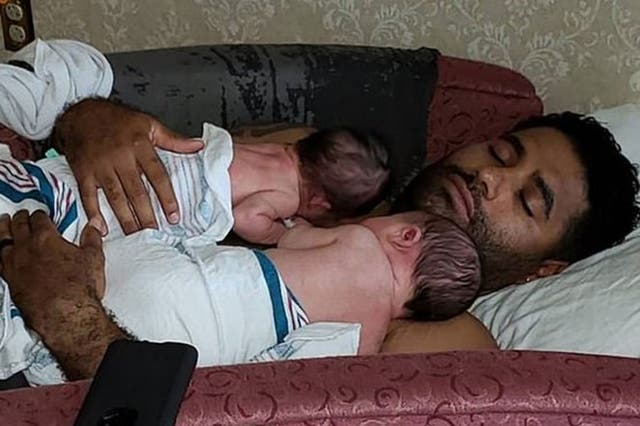 Juan Rodrigues with his two twins, Phoenix and Luna, in a photo posted online