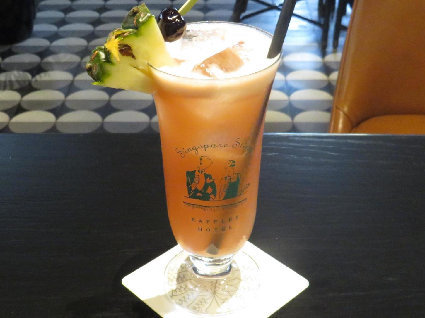 A Singapore Sling at the Raffles Long Bar is a quintessential Singapore experience
