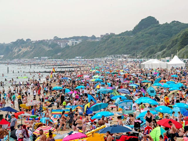 People enjoying the sun on Bournemouth beach