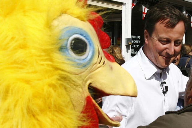 David Cameron walking around Tamworth in Staffordshire followed by a man dressed as a chicken, working for the Daily Mirror newspaper