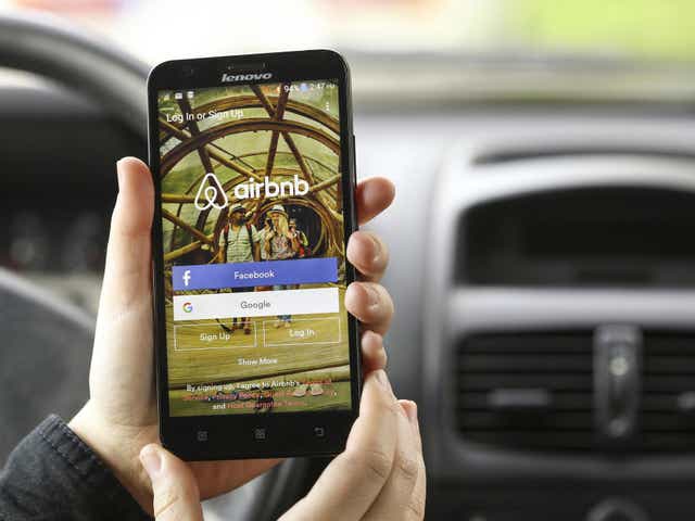 Close-up of a smartphone with the Airbnb app login screen