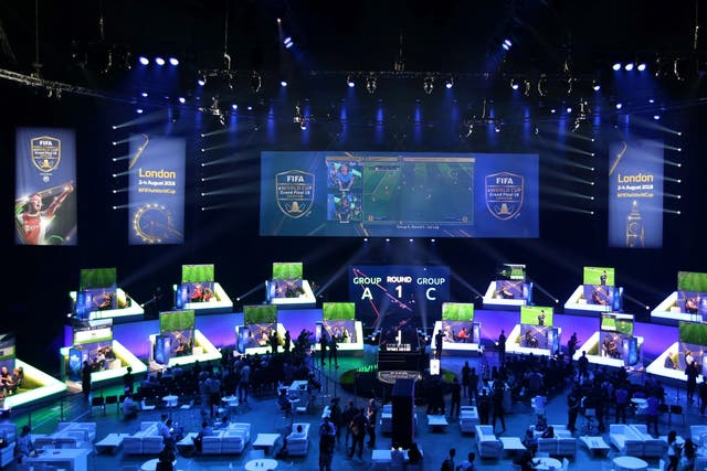 Players compete on Xbox and Playstation games consoles in the group stages of the FIFA eWorld Cup Grand Final in London on 2 August 2, 2018