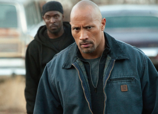 Snitch is an extremely straightforward action thriller with a lead character that ranks as Johnson's most believable: a father who goes undercover for the DEA to free his son who's imprisoned after being framed for drug dealing. The film was actually inspired by a documentary on new federal drug policies designed to encourage felons to snitch on their accomplices.