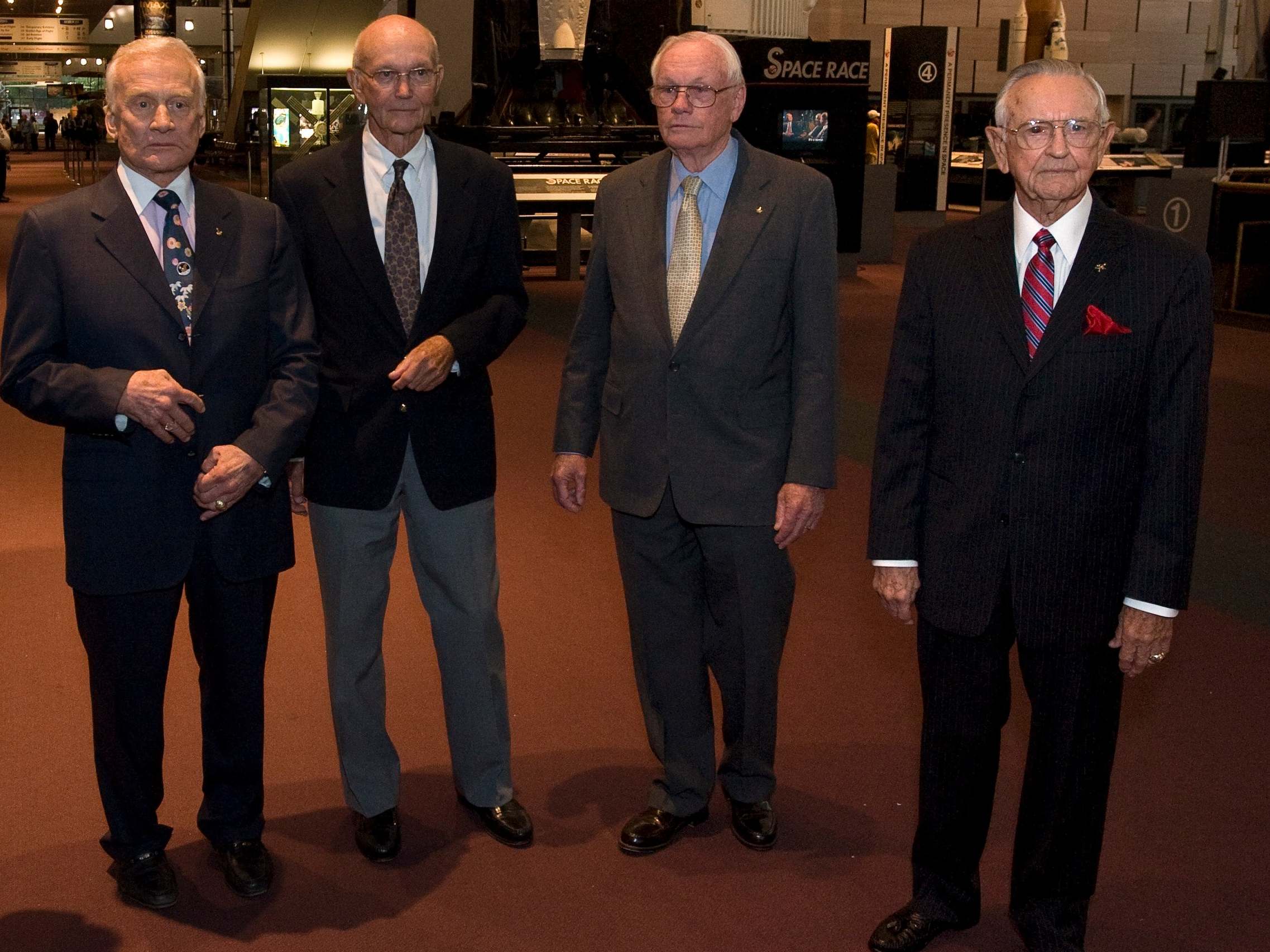 Kraft (right) with the crew of Apollo 11