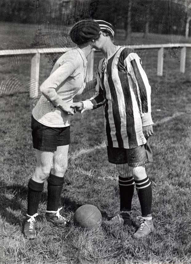 The two captains kiss prior to a 2-0 win for England (aka Dick, Kerr Ladies, in the stripes) over France at Preston in 1920