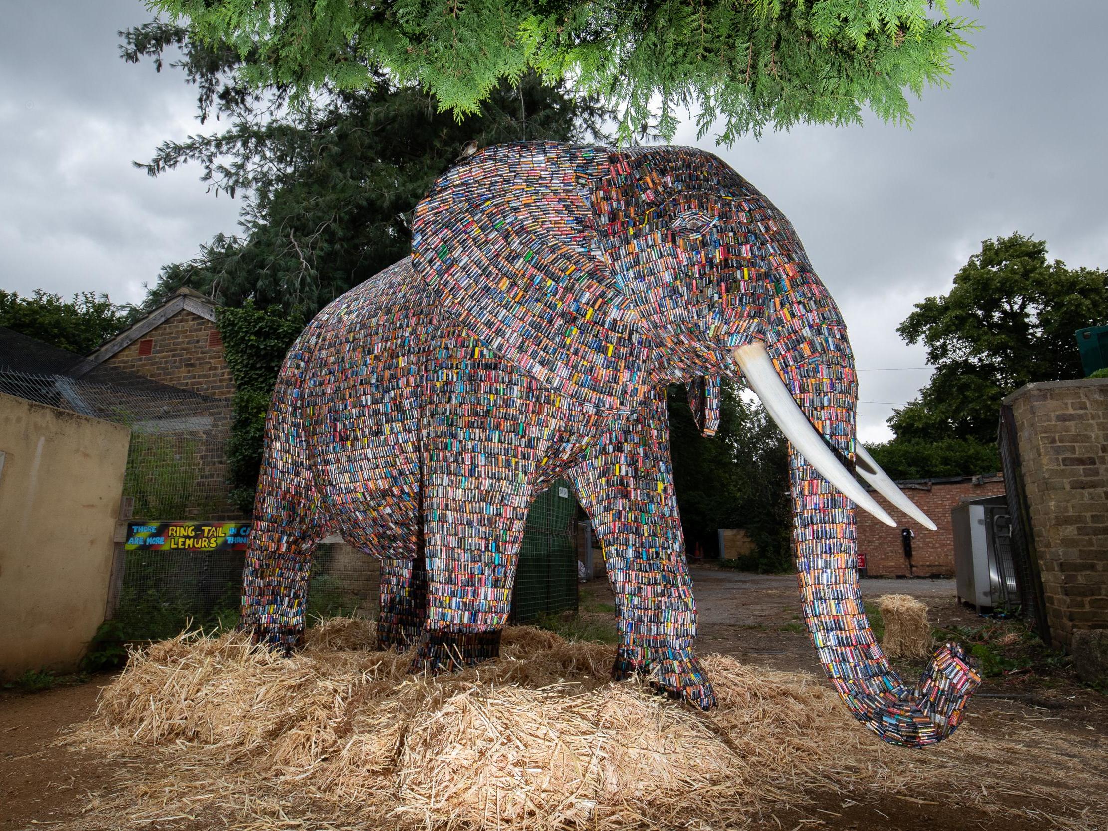 The 10-ft tall elephant is made up of nearly 30,000 batteries and weighs two tons