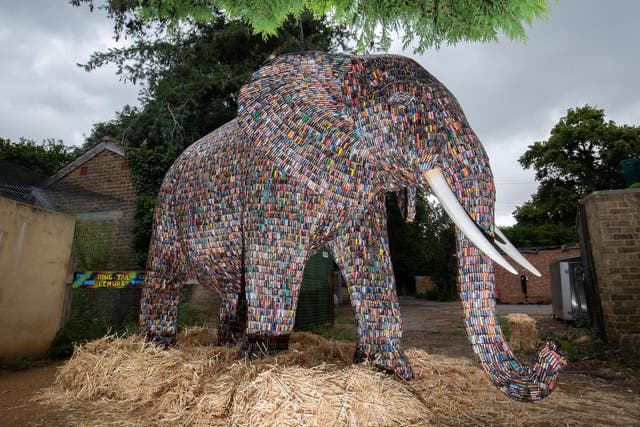 The 10-ft tall elephant is made up of nearly 30,000 batteries and weighs two tons