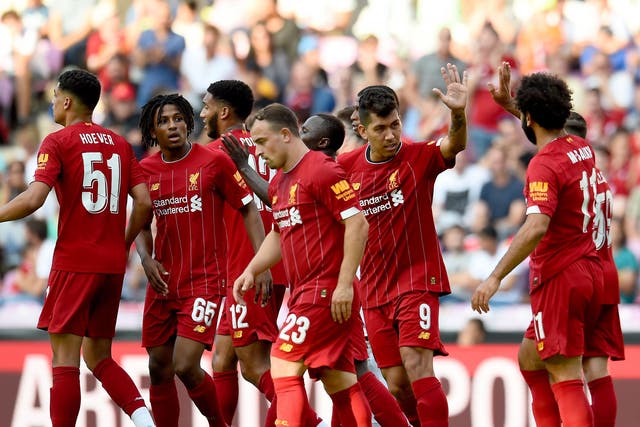 Liverpool celebrate Roberto Firmino's equaliser in 3-1 win