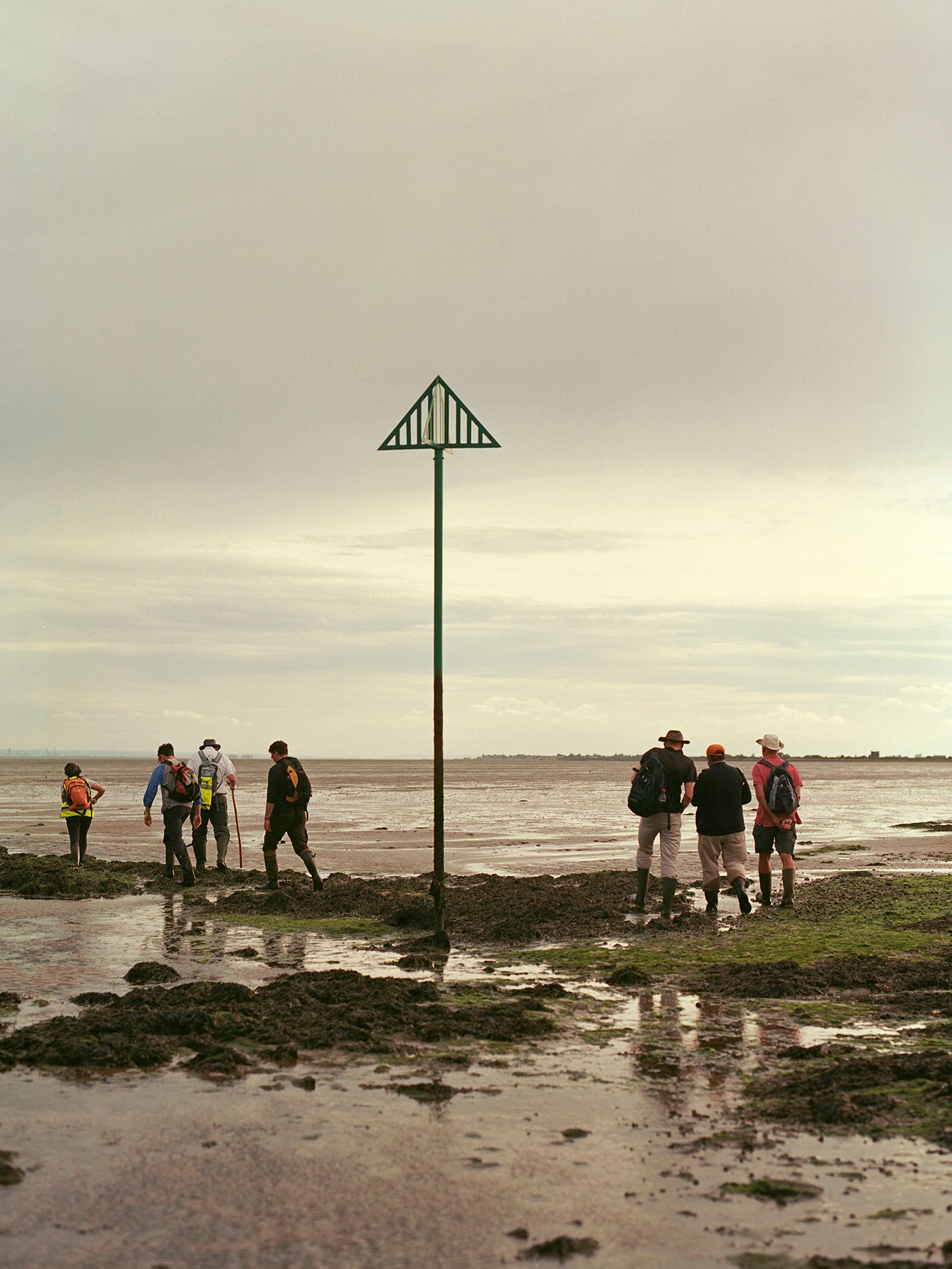 Hikers led by Brian Dawson turn around at Asplins Head along the Broomway path