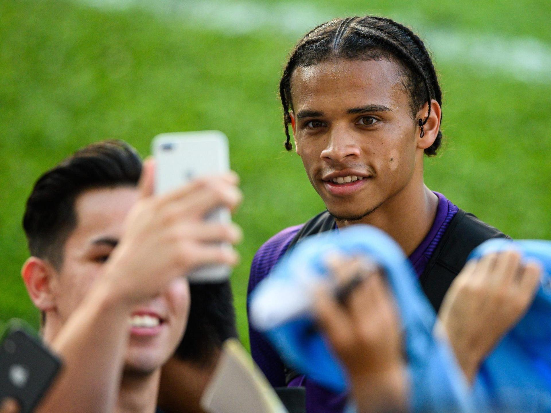 Manchester City winger Leroy Sane with supporters