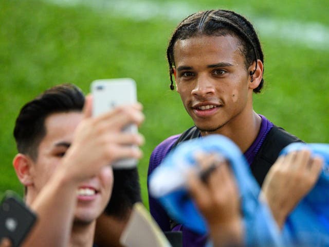 Manchester City winger Leroy Sane with supporters