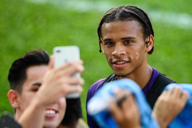 Manchester City winger Leroy Sane with supporters