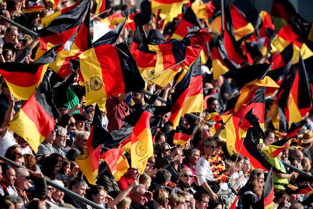 Supporters of Germany wave their flags during the women's international friendly soccer match between Germany and Japan in Paderborn, Germany, 09 April 2019