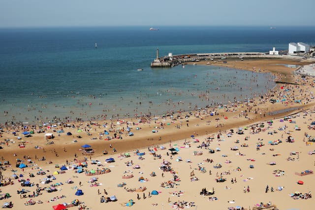 Beachgoers enjoy the sunshine in Margate on 25 July, when the UK's temperature reached a new high of 38.7C