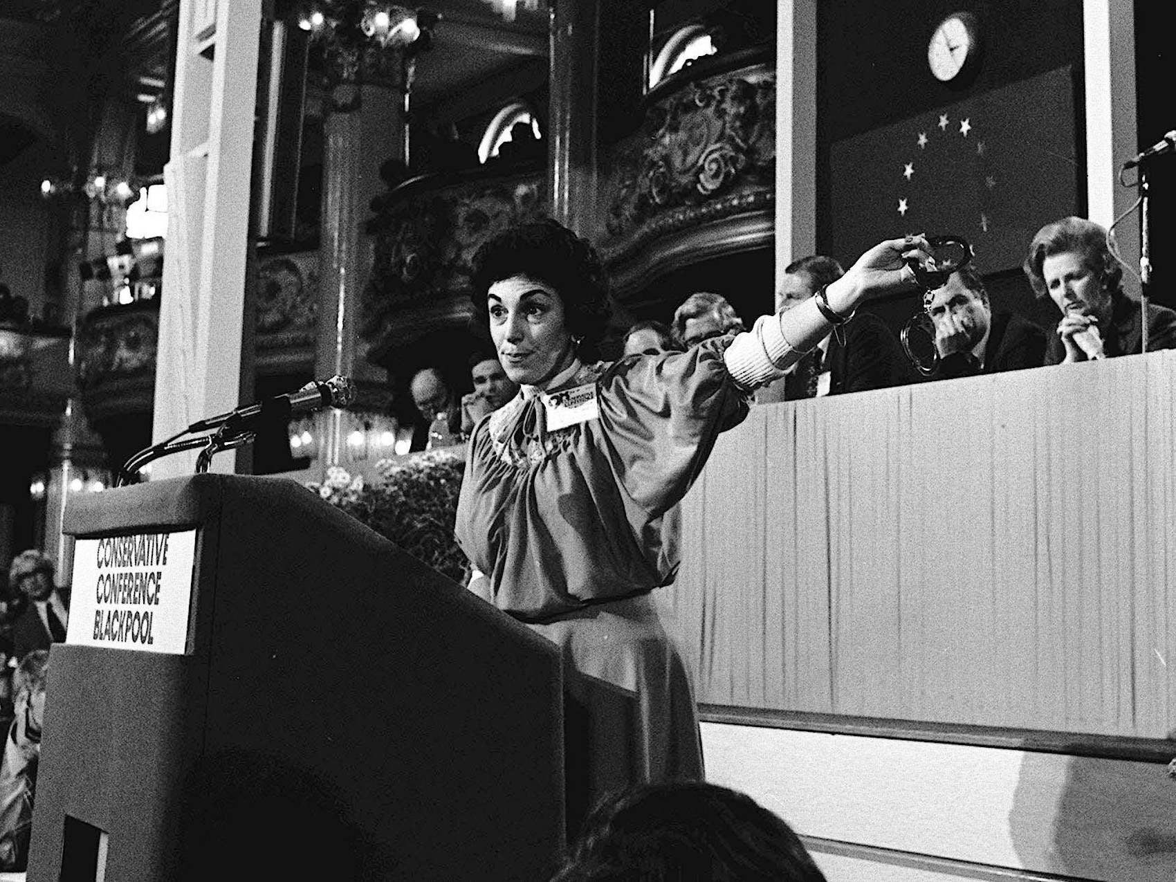 Edwina Currie brandishes a pair of handcuffs during the law and order debate at the Conservative Party Conference in 1981