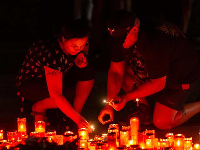 People light candles during an anti-government demonstration in Bucharest, Romania on 27 July 2019.