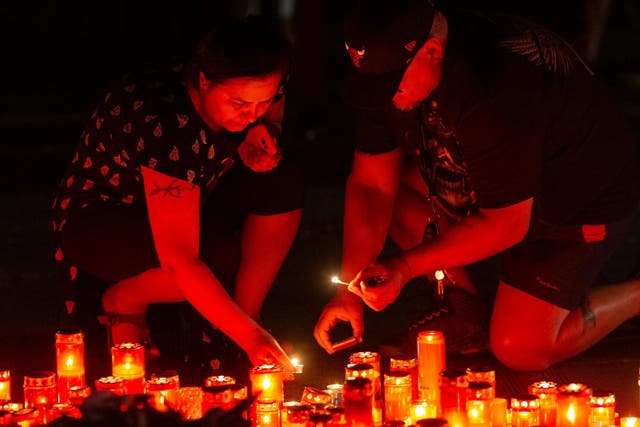 People light candles during an anti-government demonstration in Bucharest, Romania on 27 July 2019.