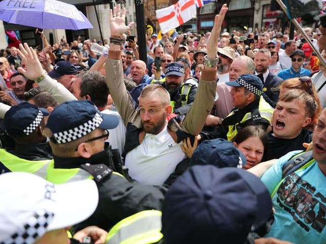 Supporters of the jailed EDL founder are blocked by police during the march in in Oxford Street