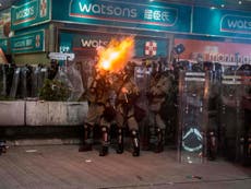 Hong Kong police fire teargas after protesters damage police station