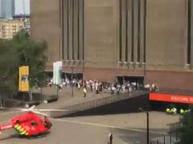 The boy was taken to hospital by air ambulance, pictured at the scene outside the gallery