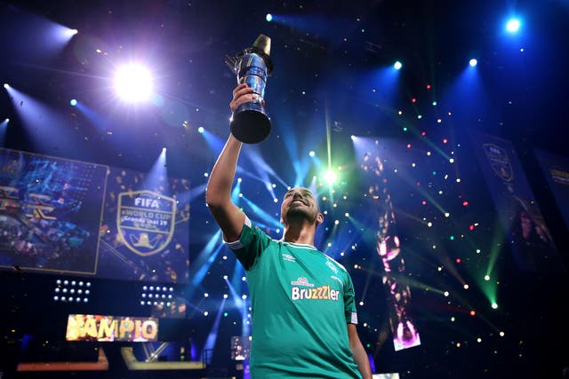 Mo Harkous (MoAuba) of Germany lifts the trophy following victory in the FIFA eWorld Cup Final against Mosaad Aldossary (Msdossary) of Saudi Arabia during Finals day of the FIFA eWorld Cup 2019