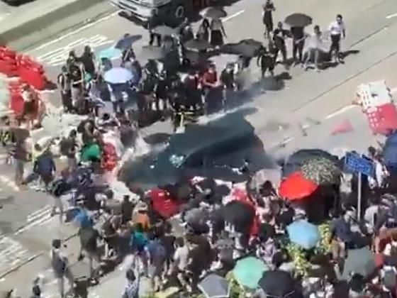 One person has been injured after a car rammed into a barricade set up by protesters in Hong Kong