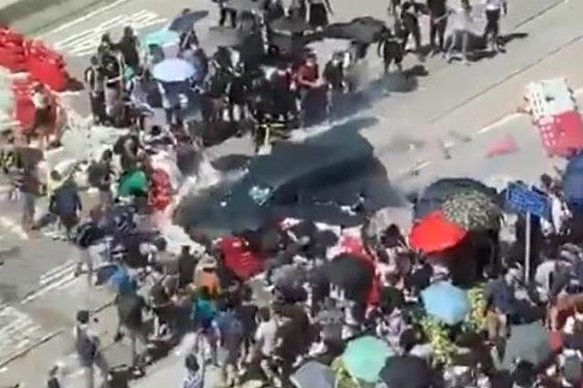 One person has been injured after a car rammed into a barricade set up by protesters in Hong Kong