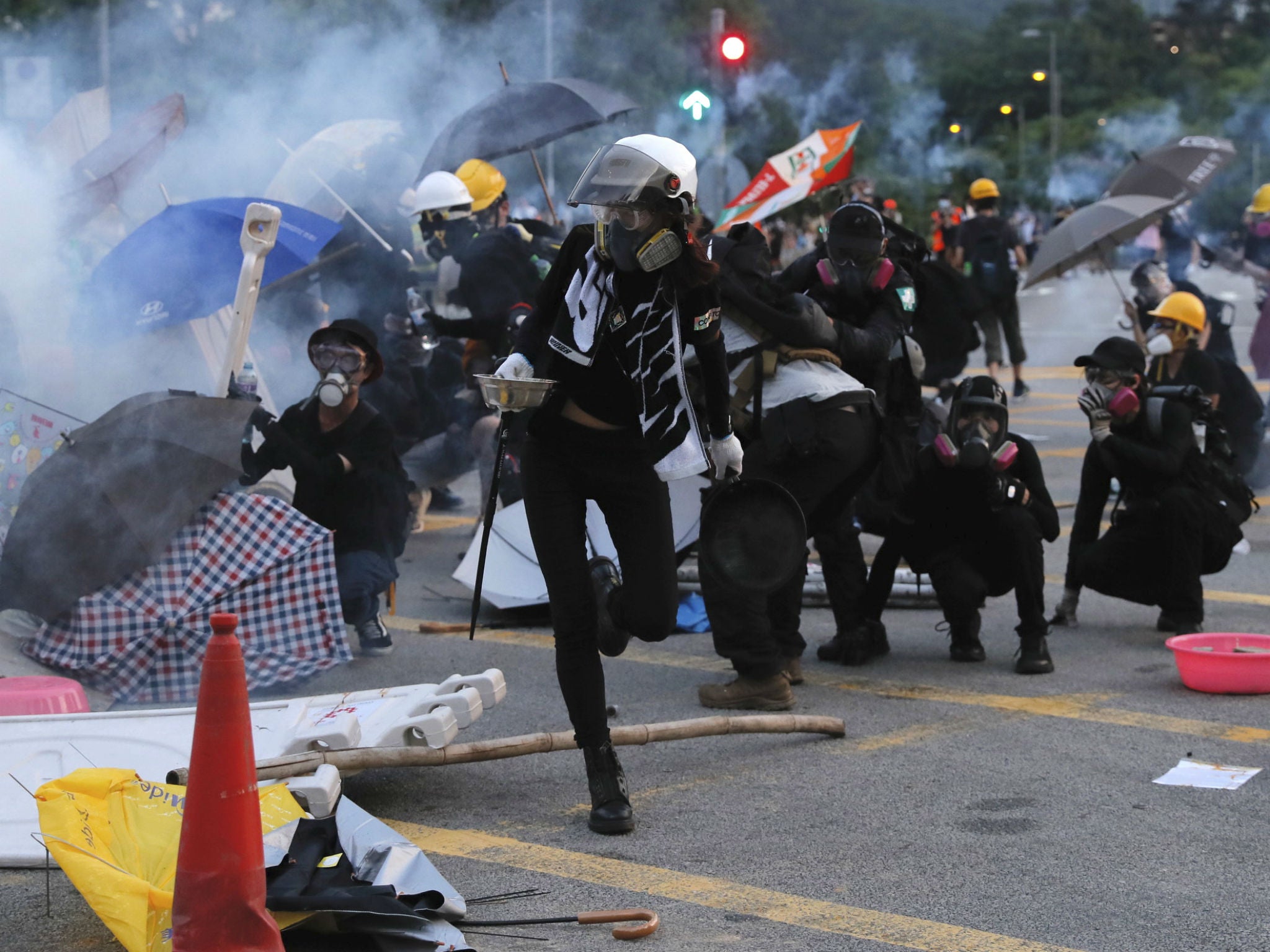 Protesters huddle during a confrontation with police