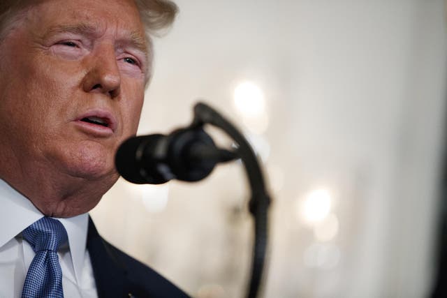 President Donald Trump speaks about the mass shootings in El Paso, Texas and Dayton, Ohio, in the Diplomatic Reception Room of the White House