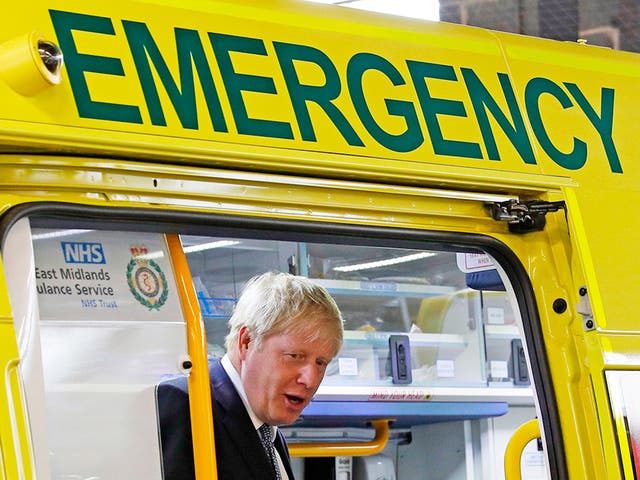 Boris Johnson inspects an ambulance during a visit to Pilgrim Hospital in Boston