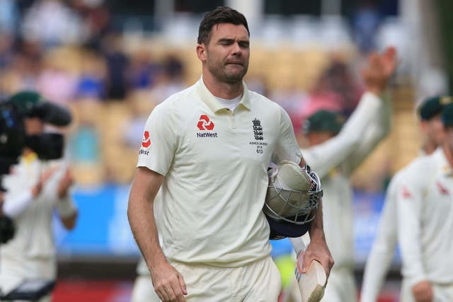 England's James Anderson walks from the field