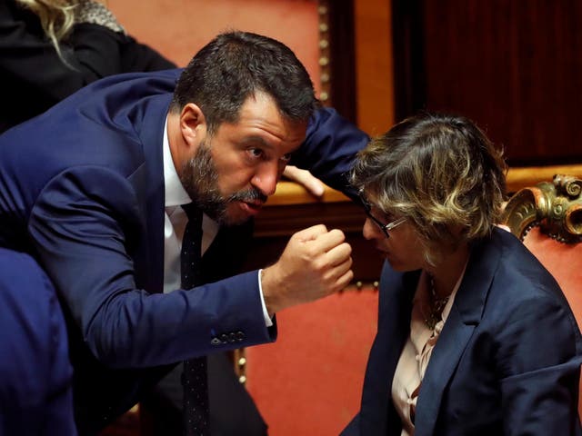 Italy's Interior Minister Matteo Salvini and Italy's Minister of Public Administration Giulia Bongiorno gesture as Italy's government is set to face Senate confidence vote on security and immigration decree in Rome, on 5 August 2019