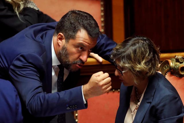 Italy's Interior Minister Matteo Salvini and Italy's Minister of Public Administration Giulia Bongiorno gesture as Italy's government is set to face Senate confidence vote on security and immigration decree in Rome, on 5 August 2019